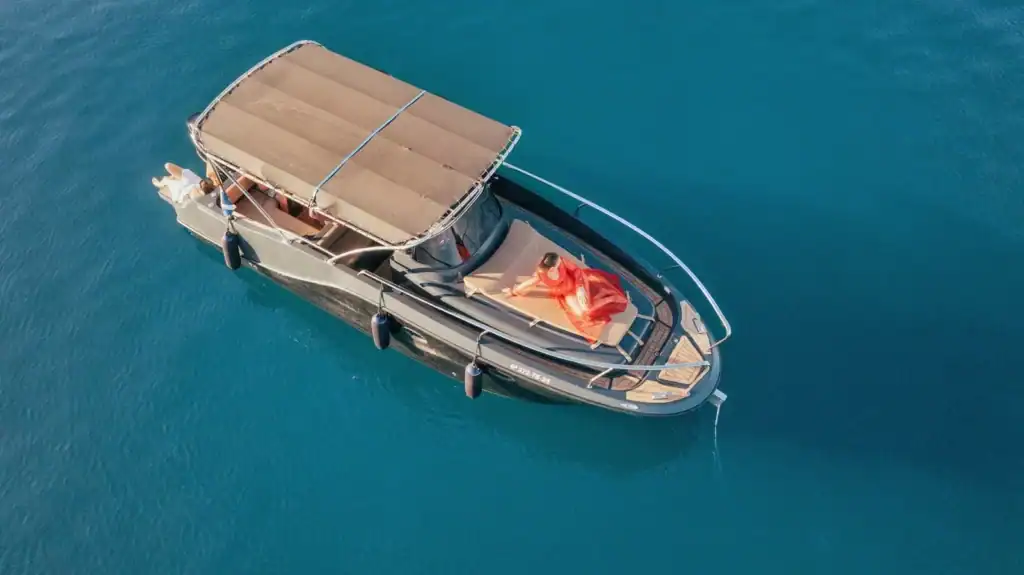Private boat charter with guest on solarium